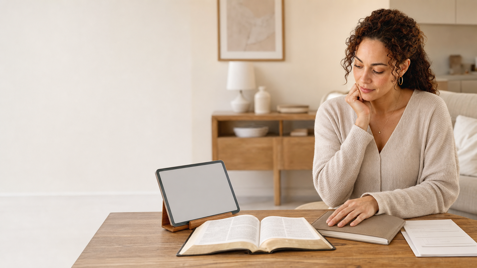 A woman choosing between a Bible, journal, guided workbook, and video devotional